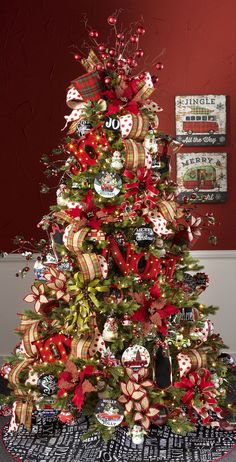 a christmas tree decorated with red and gold ribbons, bows, and other holiday decorations