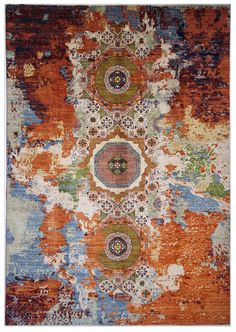 an orange, blue and green rug with different colored circles on the top of it