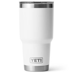 a white yeti cup sitting on top of a table