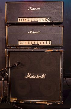 three marshall amps stacked on top of each other