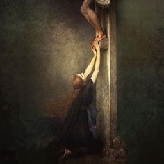 a painting of jesus on the cross being lifted by a woman who is kneeling down