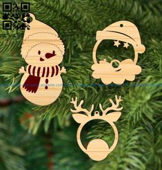 three wooden christmas ornaments hanging from a pine tree, one with a santa hat and the other with reindeer antlers