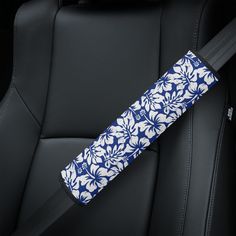 a blue and white umbrella sitting on top of a car seat