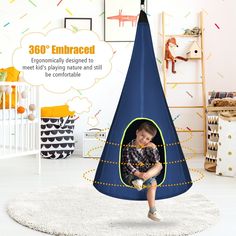 a child is sitting in a blue teepee tent with the words 360 embraced on it