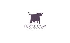 the logo for purple cow apartments, which is designed to look like a cow with its head