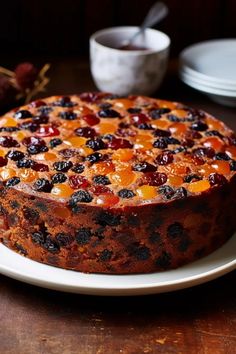 a cake on a plate with fruit toppings