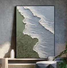 an abstract painting on the wall in a living room