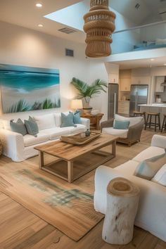 a living room filled with furniture and a painting on the wall above it's coffee table