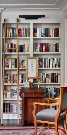 a room filled with lots of books and furniture next to a tall book shelf full of books