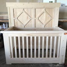 a baby crib made out of wood in a room