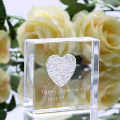 a glass block with a heart on it and the words happy anniversary written in silver