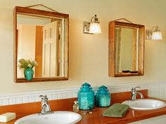 a bathroom with two sinks and mirrors in it