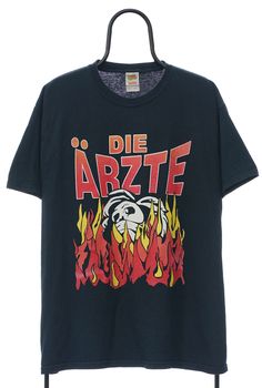 Black tee with Die Artze flames graphic on front and logo on rear. Tiny hole on front. Size (Approx. in: cm: Pit to Pit: 57, Length: 73 ) Black Flames, Rock Vintage, Band Music, Fleece Coat, Mens Graphic Tee, Vintage Accessories, Black Tee, Jean Jacket, Vintage Black