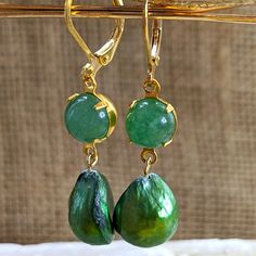 Here Is A Dangle/Drop Down Earrings Made With Green Jade, Natural And Ethically Sourced. Measurement: 8mm It Is Combined With: A Cultured Freshwater Green Pearl. The Pearl Is Dyed, And Looks Very Realistic. We Have A Listing For A Green Jade And White Pearl Combination. For More Jade Items, Please Find Matching Bracelets And Earrings. The Base Material Is Gold Plated, And Made In Israel. Pearls Are From Philippines. The Jade Originates From Malaysia. This Was Assembled In The Usa And Is Higher Q Jade Earrings, Green Pearls, Jade Jewelry, The Pearl, Green Jade, Matching Bracelets, Jade Green, Baroque Pearls, White Pearl