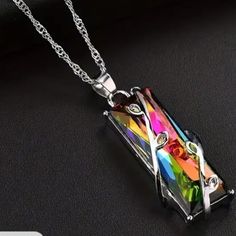 Multicolored Rectangular Rainbow Crystal Silver Pendant Necklace, Silver Leaf Encrusted Strand Pendant Necklace This Is A Beautiful Necklace Due To The Rainbow Of Colors That Can Be Seen. It Has A Silver Leaf Pattern On The Pendant. Size Of The Pendant Is: 1.46" In Height / 0.51" In Width. Matching Earrings Are Listed Separately. I Have This Necklace In Two Different Lengths. 18 Inch Necklace 16 Inch Necklace Can Be Seen In Photo 11 Within The Pictures. New Ships Immediately! Tagsadd Tag Add Up Rainbow Stone, Cheap Necklaces, Square Necklace, Bracelets Design, Chakra Necklace, Healing Necklace, Hippie Necklace, Tree Of Life Necklace, Geometric Necklace