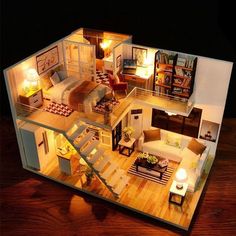 a doll house with furniture and lights inside