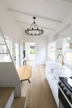 the kitchen is clean and ready to be used as a living room or dining area