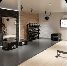 a gym with exercise equipment and mirrors