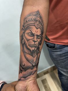 a person with a tattoo on their arm