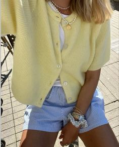 Blue striped shorts, short sleeve cardigan, pastel yellow cardigan, white tshirt, spring outfit, pinterest outfit inspo, Street style, comfy casual , cute outfit, cool girl outfit, casual chic style, oversized outfit, fashion styling , basics outfit, basics styling, casual school outfit, simple spring outfit, lazy day outfit, feminine style, style inspo, minimal style, beach day outfit, pearl necklace, Paris Mode, Yellow Cardigan, Shein Outfits, Neue Outfits, Copenhagen Style, Looks Street Style, Stunning Outfits, Stockholm Fashion, Mode Inspo