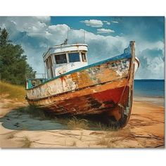 an old boat sitting on top of a sandy beach