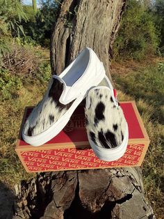 Women's 8.0, men's 6.5, white slip-on Vans.  I customized this pair with gorgeous black and white hair-on hide.  Very silky.  Stitched with black heavy duty thread, all done by hand.  Please ask any questions you may have about these shoes or a custom request.  Thanks for looking! Western Wedding Shoes, Customised Vans, White Slip On Vans, Vans Slip On, Western Wedding, White Slip, White Hair, Slip Ons, Hand Stitched