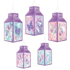 four hanging lanterns with butterflies and flowers painted on the top one is purple, the other is pink