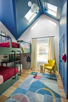 a bedroom with bunk beds and colorful rugs