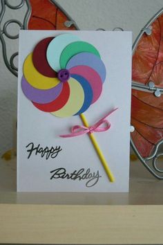 a birthday card with a colorful lollipop on it