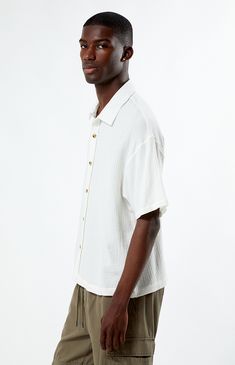 Whether you wear it for a special occasion or throw it on for a day at the skatepark, the Cream Boxy Button Down Shirt from PacSun is fashion-forward and can easily pair with the sick pieces in your closet. This button-down features a collared neckline, short sleeves, soft fabric, and a flattering fit. 


	Relaxed fit
	Short sleeves
	Collared neckline
	Button-down front closure
	PacSun branding
	100% Cotton
	Machine washable
	Model is wearing a size medium
	Model Measurements: 6'1”  Height, 34.5” Chest, 29" Waist Summer Cream Camp Shirt With Relaxed Fit, Cream Camp Collar Shirt For Summer, Summer Cream Shirt With Camp Collar, Cream Summer Shirt With Camp Collar, Casual Cream Shirt With Button Closure, Casual Cream Button-up Shirt, White Casual Shirt With Camp Collar, White Relaxed Fit Casual Camp Shirt, Casual White Camp Shirt For Spring