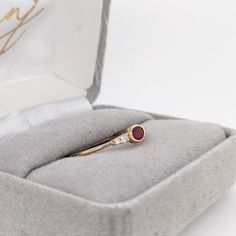 A dainty east west ring is perfect for the minimalist in your life or for giving someone their first piece of jewelry :) This ruby presents a mixture of red hues which is perfectly accentuated by two diamonds on each side. The slim yellow gold shank provides a lightweight, effortless look! This ring is made with solid 14K Gold and natural Earth mined SI / G-H diamonds. As listed, this ring is ready to ship. If you're interested in purchasing this setting with a different center stone please mess Minimalist 14k Gold Red Ruby Ring, Dainty Oval Red Ruby Ring, Minimalist Red Oval Rings, Red 14k Gold Dainty Birthstone Ring, Minimalist Red Birthstone Ring In 14k Gold, Dainty Red Birthstone Ring In 14k Gold, Minimalist Oval Ruby Ring For Anniversary, Dainty Oval Ruby Ring In Rose Gold, Minimalist Oval Ruby Wedding Ring