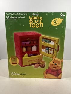 the box for winnie the pooh is open and ready to be used as a toy