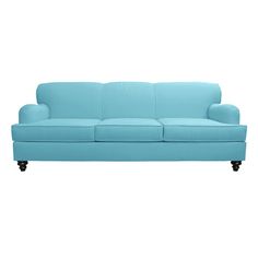 a blue couch sitting on top of a white floor