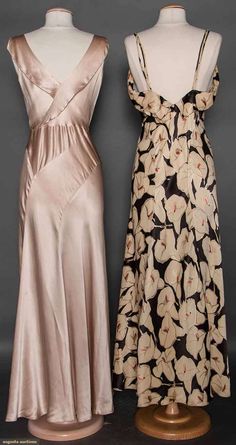 TWO SILK EVENING GOWNS, 1930s (back views) 1 bias cut champagne charmeuse, low cowl neck, grass green waist panel, green & rhinestone buckle; 1 black satin w/ white calla lily print, spaghetti straps & low back 1930's Dresses, Vintage Fashion 1930s, Augusta Auctions, 1930 Fashion, 1930's Fashion, Silk Evening Gown, Satin Evening Gown, 30s Fashion, Bias Cut Dress