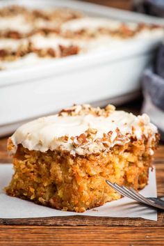 a piece of carrot cake with cream cheese frosting