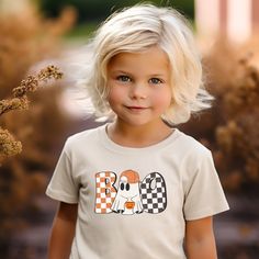 Get your little one ready for Halloween with this playful "Checkered Boo" toddler t-shirt. Perfect for Halloween parties and trick-or-treating, this shirt features a spooky "boo" design that is sure to bring a smile to everyone's face. Made with high quality materials, this Halloween kids shirt is comfortable and durable. Kids Halloween Shirts, Boo Design, Halloween Shirts Kids, Ready For Halloween, Halloween Shirts, Trick Or Treating, Kids Halloween, Halloween Parties, Halloween Kids