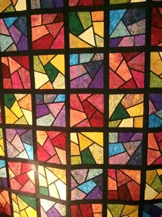 a colorful stained glass window in a room