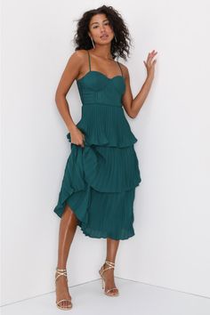 Get ready to be swept away to a world of romance by the Lulus Cascading Crush Emerald Green Tiered Bustier Midi Dress! Lightweight pleated woven fabric shapes adjustable spaghetti straps that support a bustier-style bodice with seamed cups. A fitted waist tops a tiered skirt that ends at a midi hem. Hidden back zipper/clasp. Fit: This garment fits true to size. Length: Mid-calf length. Size medium measures 44" from top to bottom. Bust: Great for any cup size. Waist: Fitted - very fitted at natur Green Pleated Dress With Spaghetti Straps, Pleated Spaghetti Strap Dress For Date Night, Semi Formal Midi Dresses, Bustier Midi Dress, Black Floral Print Dress, Cocktail Dress Wedding Guest, Lulu Fashion, Green Midi Dress, Midi Dress Sleeveless