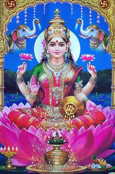 the hindu goddess sitting on top of a lotus flower