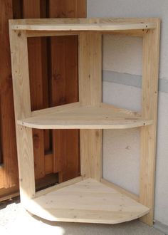 two wooden shelves sitting next to each other