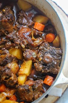 beef stew with carrots and potatoes in a pot