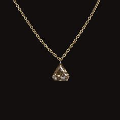 This eye catching necklace features a vibrant 1.02 carat shield cut diamond set in a classic 14k yellow gold setting. The diamond displays a lively brilliance and a rich champagne hue. The 14k yellow gold setting and sleek chain are elegant in their simplicity, allowing the diamond to take center stage. Pretty and classic, this natural diamond necklace is perfect for everyday wear! The 1.02 carat diamond is a rich cognac hue that pairs beautifully with the yellow gold. Graded SI2-SI3 for clarity Fancy Champagne, Necklace Fancy, Triangle Pendant, Yellow Gold Setting, Diamond Set, Elegant Necklaces, Dream Ring, Natural Earth, Diamond Fashion