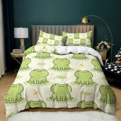 a bed with green frog print on it