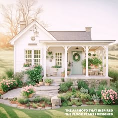 a small white house with steps leading to the front door and flowers in pots on the porch