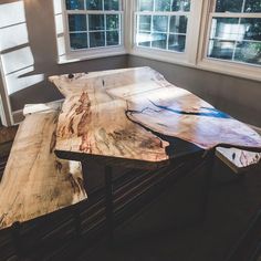 the table is made out of wood and has two different sections on each one side