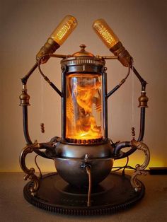 an old fashioned lamp with two lamps on it's sides and some wires attached to the