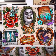 an assortment of stickers and decals are on display at a tattoo shop in san francisco, california