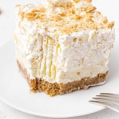 a close up of a piece of cake on a plate with a fork next to it