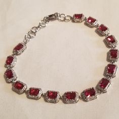 *Vintage Ruby,White Topaz Set In Sterling Silver (925) Bracelet Stamped 925 Measures:7.5" With 1" Extender Fits Most Size Wrists Adjustable Beautiful Rectangular Ruby With White Topaz Halo Around Each One Tennis Bracelet Style *Vintage In Style Or Age Not Condition;Nwot Condition Any Questions Please Feel Free To Ask!Or Make Me A Reasonable Offer! Red Ruby Jewelry, Red Sterling Silver Anniversary Bracelet, Classic Sterling Silver Party Bracelet, Red Sterling Silver Vintage Bracelets, Formal Red Sterling Silver Bracelet, Red Sterling Silver Bracelet For Formal Occasions, Red Sterling Silver Bracelet For Anniversary, Elegant Red Sterling Silver Bracelet, Elegant Red Gemstone Sterling Silver Bracelet