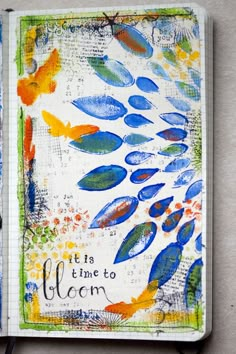 an open notebook with colorful designs on it